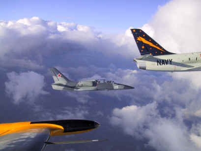 L-39 formation near clouds