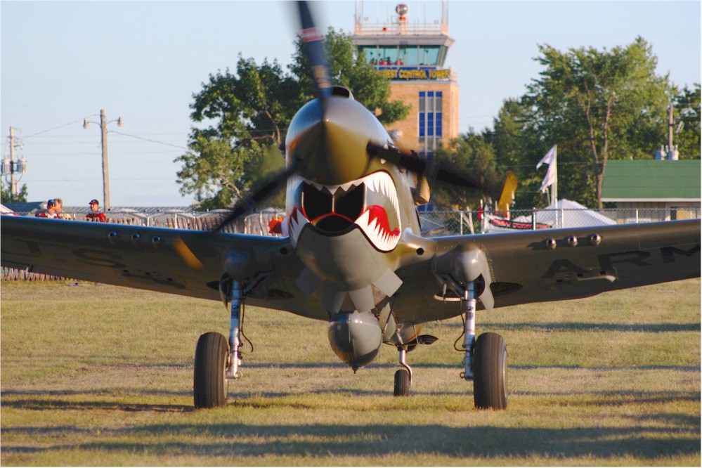 P-40 Warhawk taxies into parking area